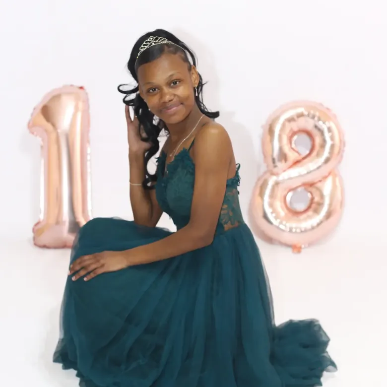 18th birthday session, a young woman in a teal tulle gown with rose-gold number balloons